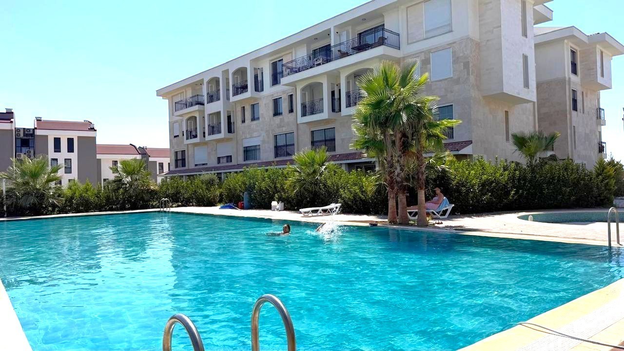 3+1 APARTMENT FOR SALE WITH MOUNTAIN AND POOL VIEWS IN DEĞİRMENDERE, KUŞADASI