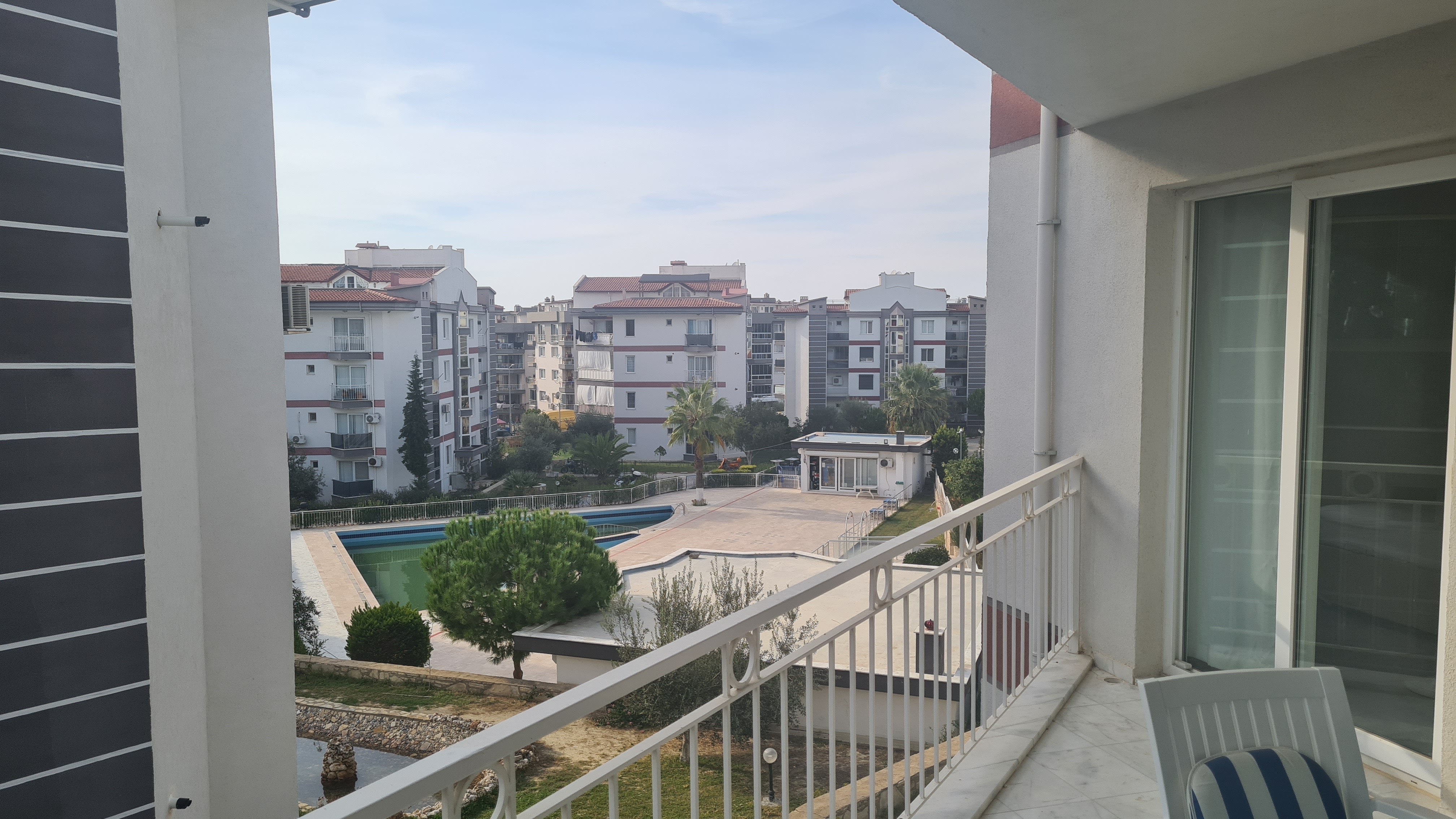 Comfortable 3+1 Apartment for Sale in a Secure Poolside Site in Kuşadası