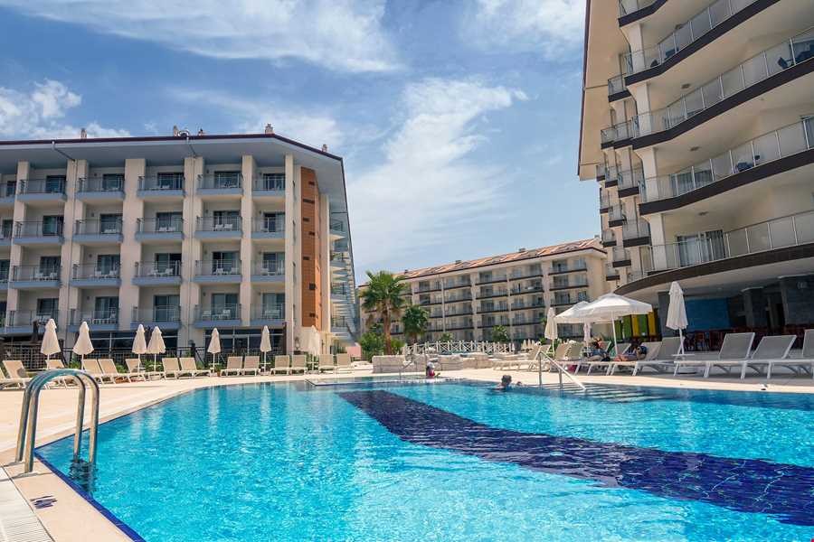 КВАРТИРА 1+1 В RAMADA RESORT В КУШАДАСЫ.