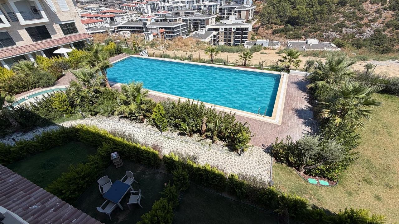 3+1 APARTMENT FOR SALE WITH MOUNTAIN AND POOL VIEWS IN DEĞİRMENDERE, KUŞADASI